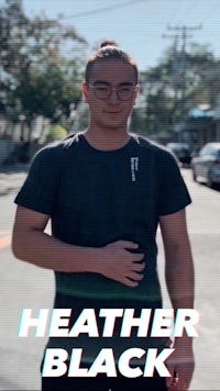 a man in a t - shirt with the words heather black