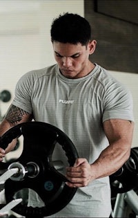 a man lifting weights in a gym