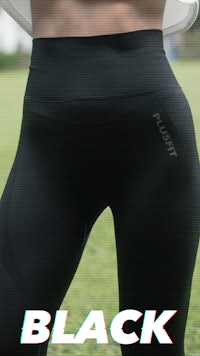 a woman wearing black leggings with the word black